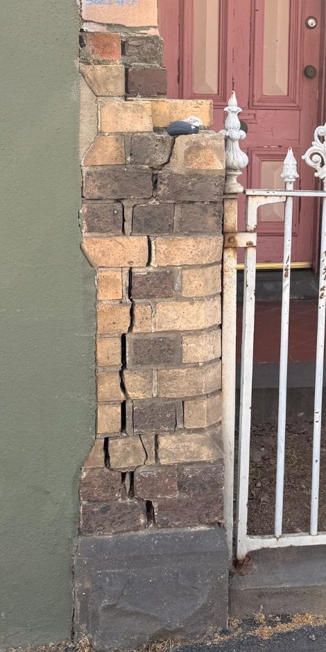 Existing masonry crack photographed for a property condition record
